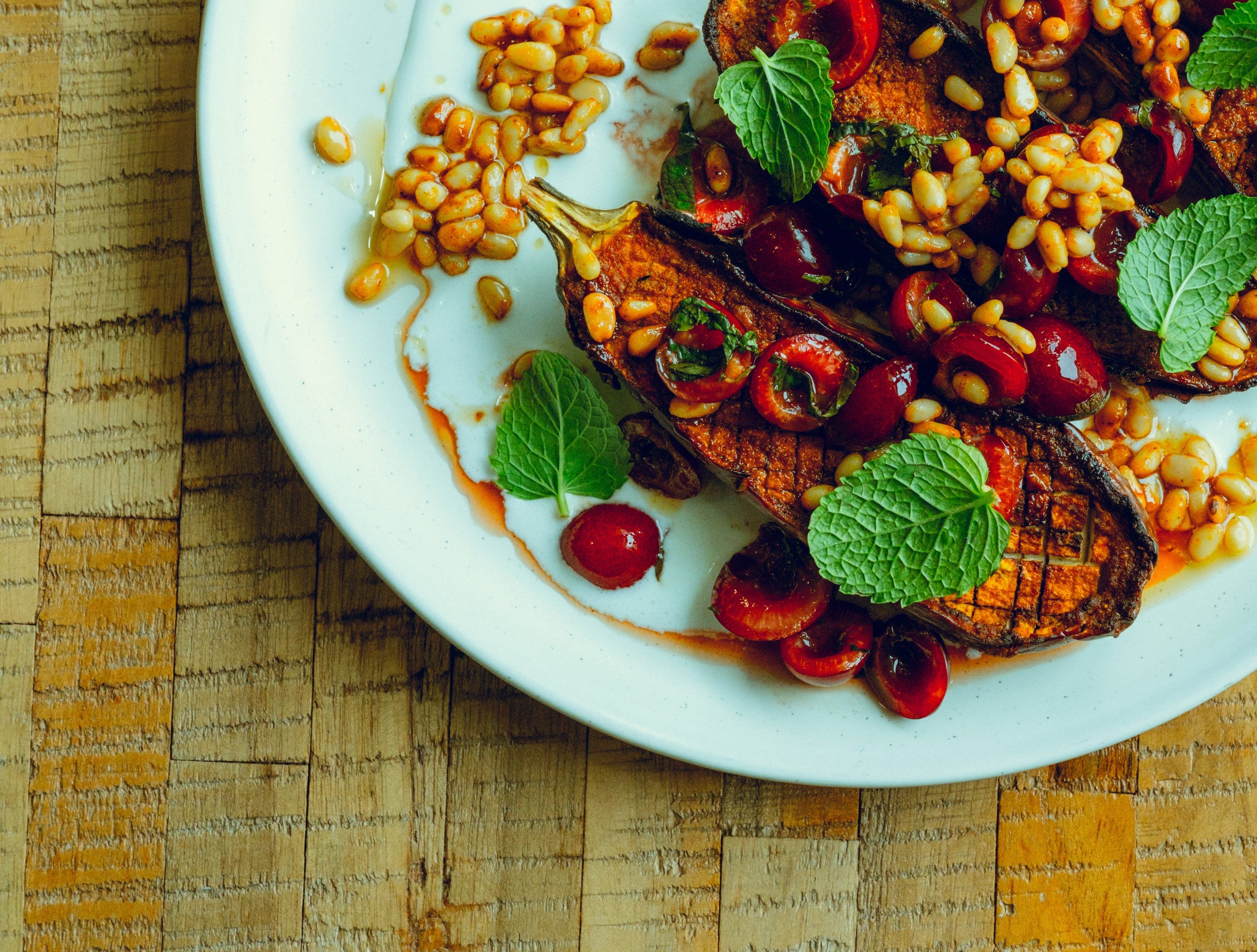 Roasted Eggplant with Cherries, Whipped Feta + Pine Nut Dressing